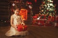 Happy child girl with christmas gift at home Royalty Free Stock Photo