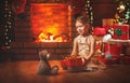 Happy child girl with christmas gift at home Royalty Free Stock Photo