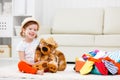 Happy child girl collect suitcase on vacation Royalty Free Stock Photo