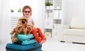 Happy child girl collect suitcase on vacation Royalty Free Stock Photo