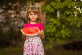 Happy child girl eats watermelon in summer Royalty Free Stock Photo