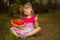 Happy child girl eats watermelon in summer Royalty Free Stock Photo