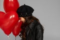 Happy child girl holding red heart shaped balloon Royalty Free Stock Photo