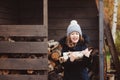 Happy child girl picking firewood from shed in winter Royalty Free Stock Photo