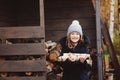 Happy child girl picking firewood from shed in winter Royalty Free Stock Photo