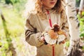 Happy child girl picking wild mushrooms on the walk in summer Royalty Free Stock Photo