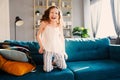 Happy child girl playing at home in cozy weekend morning Royalty Free Stock Photo