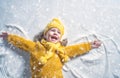 Kid making snow angel.