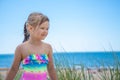 Happy child girl portrait on the beach