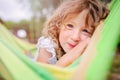 Happy child girl relaxing in hammock in summer Royalty Free Stock Photo