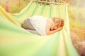 Happy child girl relaxing in hammock in summer forest Royalty Free Stock Photo