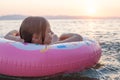 Happy child girl relaxing soaking up the sun and sea Royalty Free Stock Photo