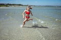 Happy child girl running and enjoying summer at sea at vocation Royalty Free Stock Photo