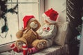 Happy child girl sitting back in the winter window Christmas Royalty Free Stock Photo