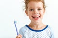 Happy child girl smiles with toothbrush Royalty Free Stock Photo