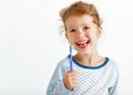 Happy child girl smiles with toothbrush Royalty Free Stock Photo