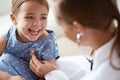 Happy child, girl and stethoscope of doctor for medical consulting, healthy lungs and listening to heartbeat. Face of Royalty Free Stock Photo