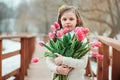 Happy child girl on warm winter forest walk, soft toned Royalty Free Stock Photo