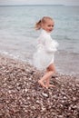 Cute Little Girl in a White Dress