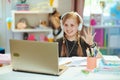 Happy child having distance education at home in sunny day Royalty Free Stock Photo