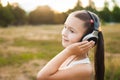 Happy child with headphones listening music