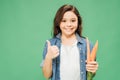 Happy child holding carrots and showing thumb up sign isolated Royalty Free Stock Photo