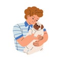 Happy child holding cute little dog on arms. Kid caring about puppy of pug breed. Love and friendship of boy and doggy