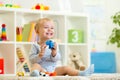 Happy child holding elefant toy