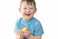 A happy child holds delicious French sweets in his palms. Macaron. Horizontal photo, a boy of European appearance. White