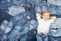 Happy child on jeans background. Denim fashion