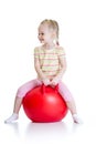 Happy child jumping on bouncing ball Royalty Free Stock Photo