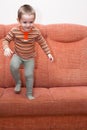 Happy child jumping on sofa Royalty Free Stock Photo