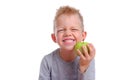 Happy child kid boy smiling with green apple on white background. Health care, dental hygiene, brushing teeth concept