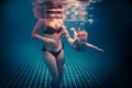 Happy child learning swimming underwater in swimming pool during diving training with helping mother Royalty Free Stock Photo