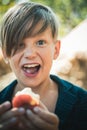 Happy child life. Holidays in outdoors with parents and tasty natural fruit. Happy holidays. Happy children`s day. Royalty Free Stock Photo