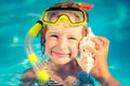 Happy child listen to seashell at the beach Royalty Free Stock Photo