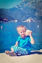 Happy child listening seashell at the beach Royalty Free Stock Photo