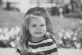 Happy child. little child posing on meadow with green grass