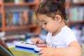 Happy child little girl pianist plays on a toy piano. Royalty Free Stock Photo