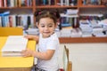 Happy child little girl reading a book. Royalty Free Stock Photo