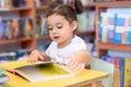 Happy child little girl reading a book. Royalty Free Stock Photo