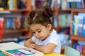 Happy child little girl reading a book. Royalty Free Stock Photo