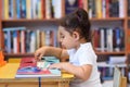 Happy child little girl reading a book. Royalty Free Stock Photo