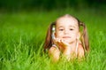 Happy child little girl in white dress lying on grass Summer Royalty Free Stock Photo