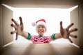 Surprised child unpack Christmas gift box Royalty Free Stock Photo