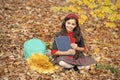 happy child with maple leaf bunch and backpack outdoor. autumn nature. childhood happiness. Royalty Free Stock Photo