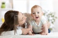 Happy child near to mom in her room Royalty Free Stock Photo