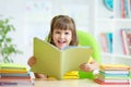 Happy child with opened book Royalty Free Stock Photo