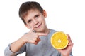 Happy child with orange isolated on white