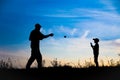 A Happy child with parent playing baseball concept in park in nature